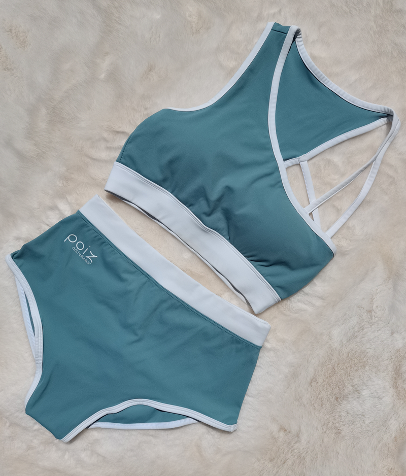 Teal & White one shoulder sports bra and high-waisted shorts
