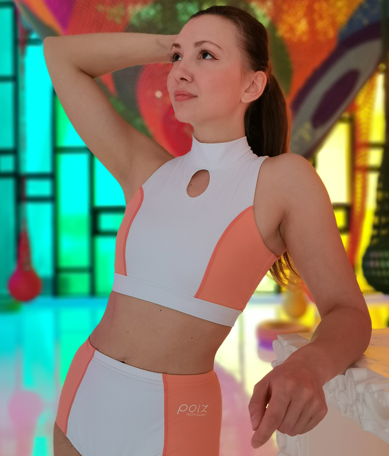 Woman with brown eyes and hair wearing Pole Dance Set in white and orange colours combination